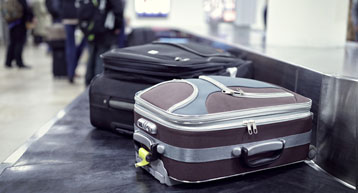 small suitcase on security conveyor belt small suitcase on security conveyor belt
